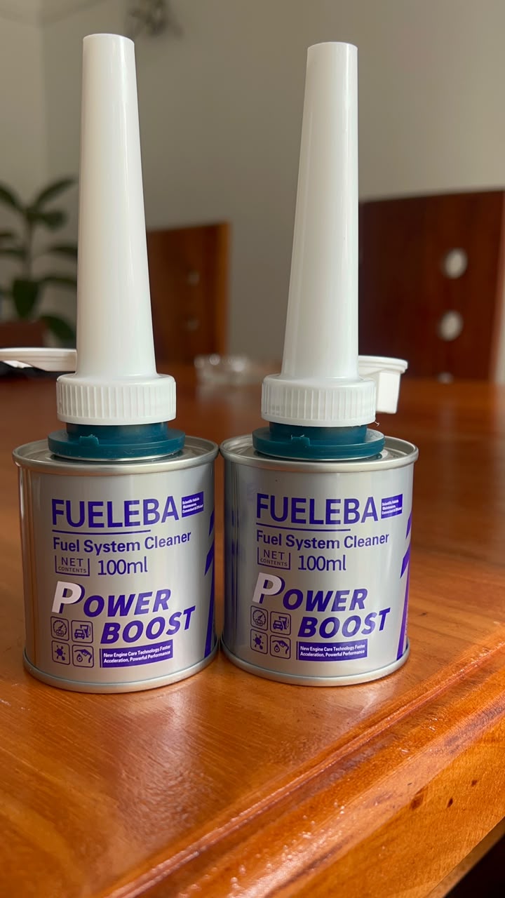 Two cans of FUELEBA Power Boost fuel system cleaner