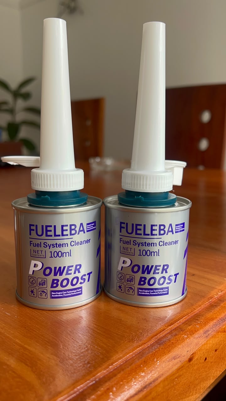 Two cans of FUELEBA Power Boost fuel system cleaner with pour spouts
